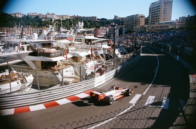 an 80's Formula 1 car on a race track at Monaco