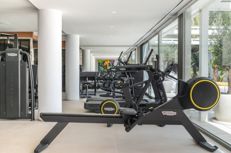State-of-the-art gym with direct pool access at Villa Serenity