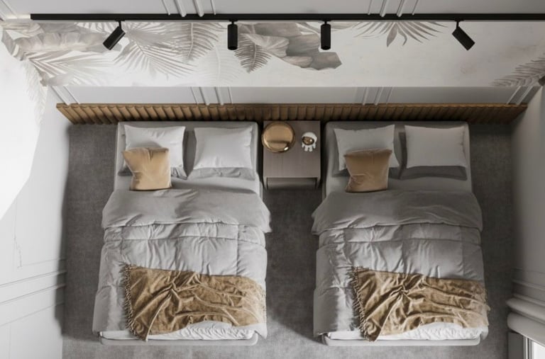 two beds in a bedroom with a wooden headboard Nour Nagy Designs