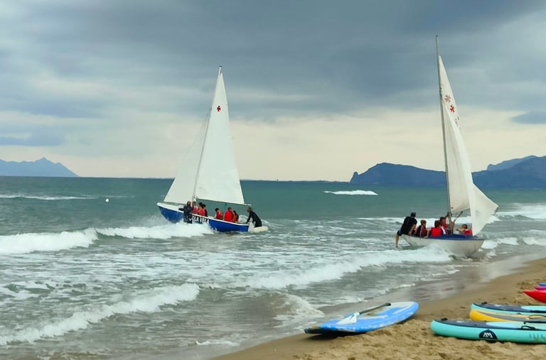 a group of people on a beach with surfboards