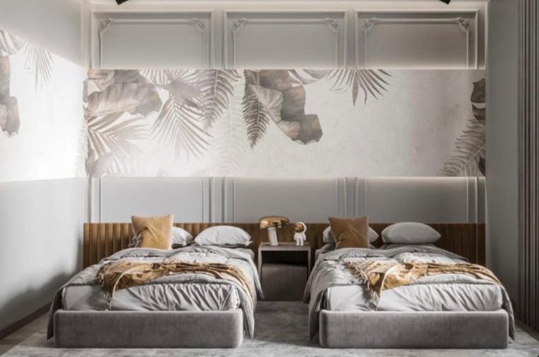 a bedroom with two beds and a wall mural Nour Nagy Designs