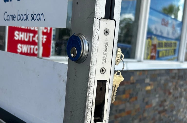 Commercial locksmith repairing office door lock in North Florida