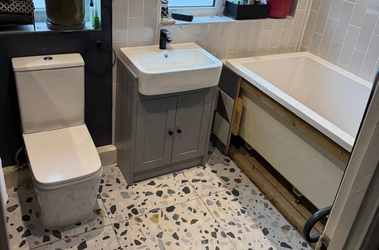Completed bathroom showing expert second fix plumbing work in Pershore