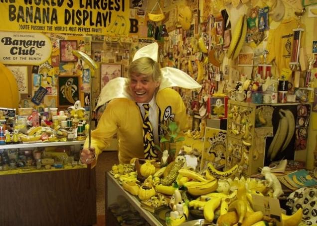 a man in a yellow shirt and a banana peeler