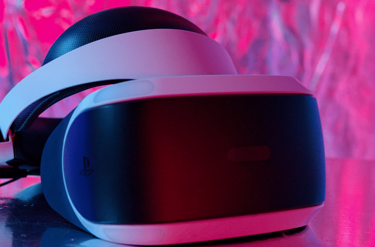 a pair of headphones with a pink background