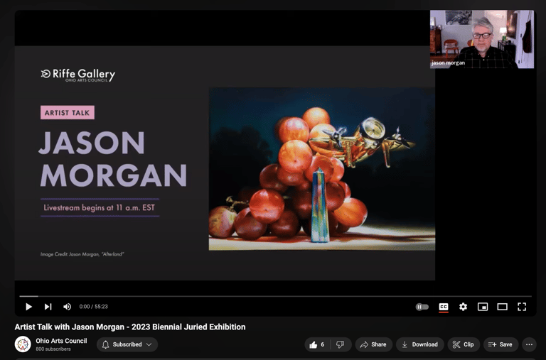 a video of an artist speaking about a painting of grapes and a golden airplane