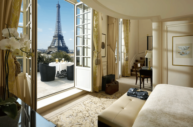 luxury bedroom with a view of the eiffel tower