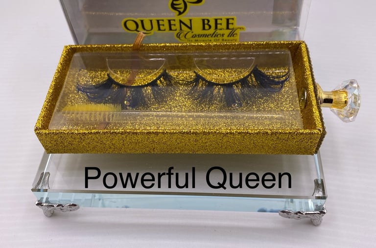 a box of eyelashes with a gold glittered eyeliner