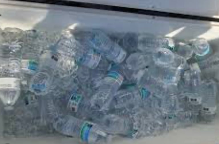 a coolerbox filled with water bottles of water