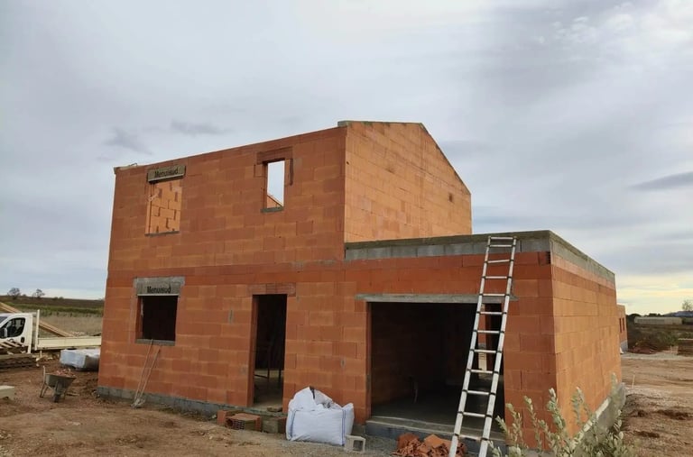 a house being built into a house with a ladder