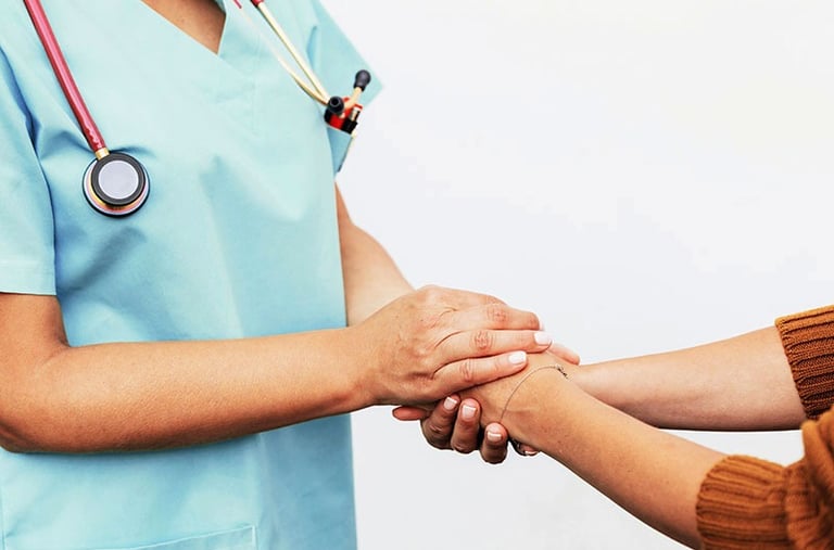 female doctor holding the hands of a patient