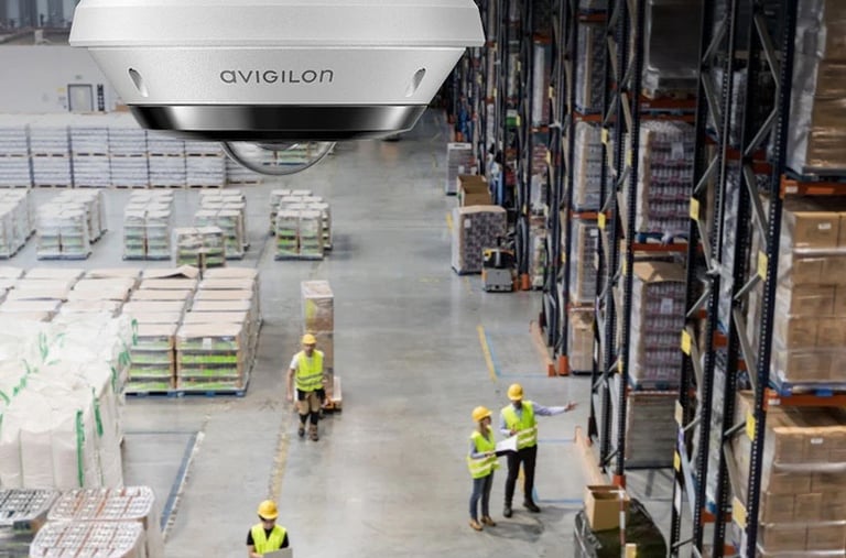 Warehouse equipped with AI-surveillance cameras monitoring inventory and employee activity.