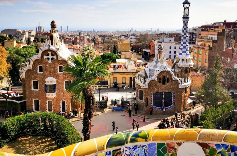 Panoramic view of Park Güell in Barcelona with Gaudi's colourful mosaic gatehouses