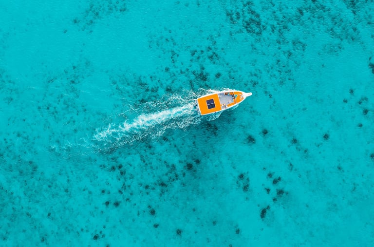 Boat in turquoise water in a tropical destination