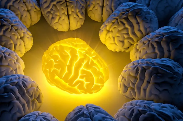A yellow glowing brain in the middle of darker brains, illuminating them.