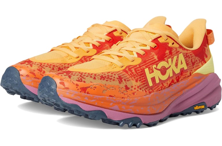 Hoka Speedgoat 6 trail running shoe on dirt path, showing Vibram Megagrip outsole and breathable mesh upper.