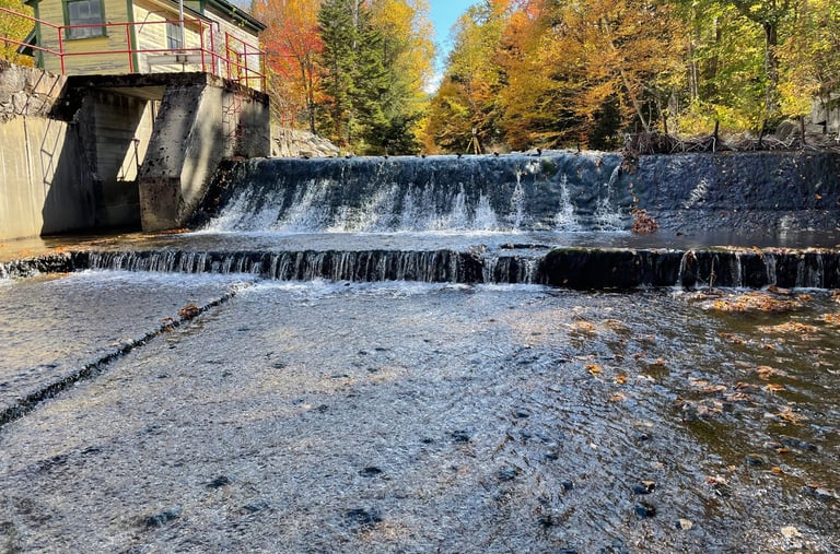 a waterfall in the middle of a river