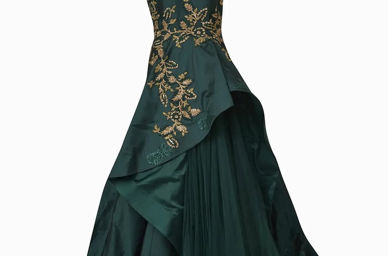 a green dress with a gold and black dress