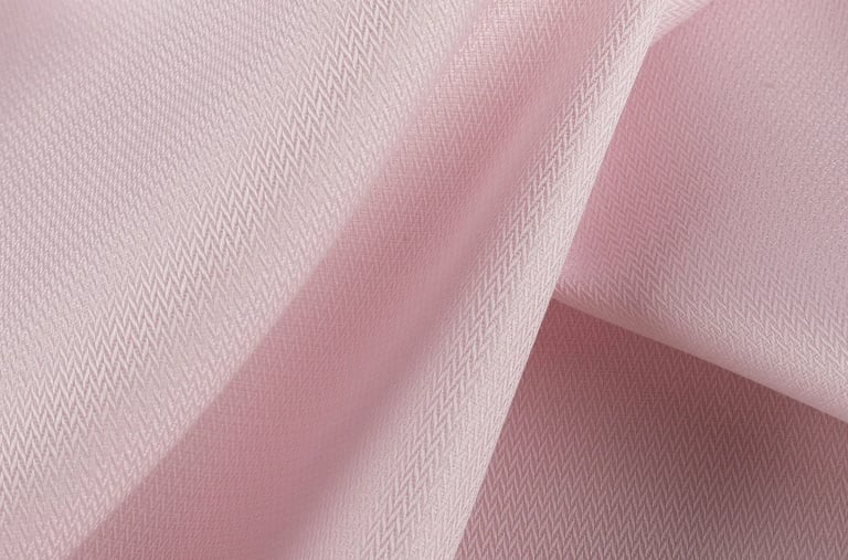 a pink fabric covered fabric with a white background