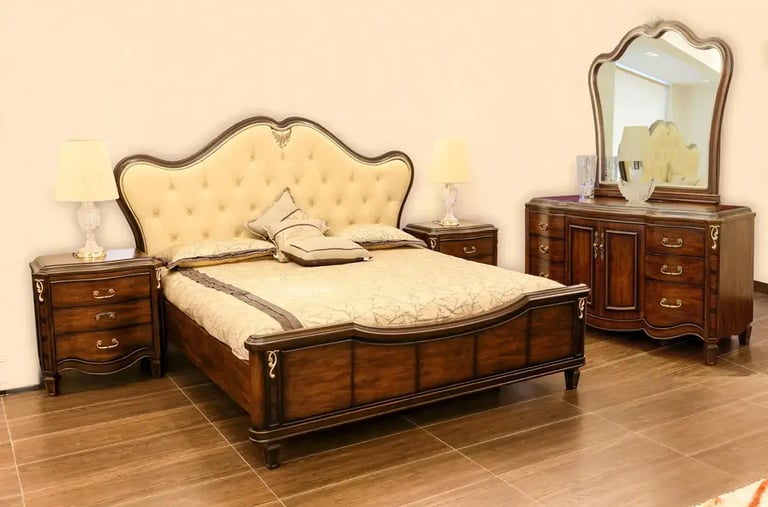 a bedroom with a bed and a mirror