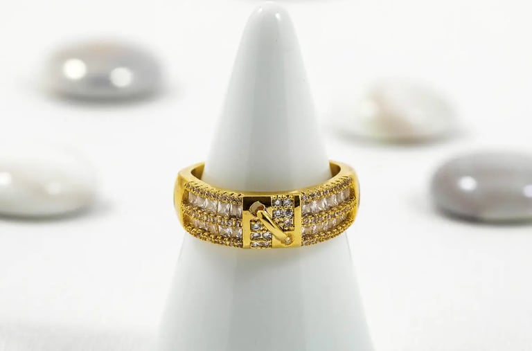 a ring with a diamond ring on top of a white cone