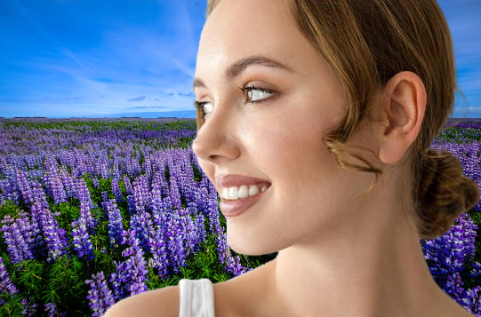 young woman in field of lupines