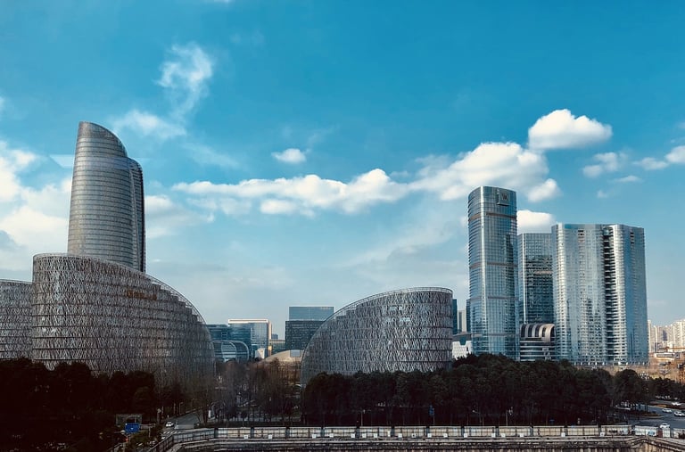 a city skyline with skyscrapers and a river