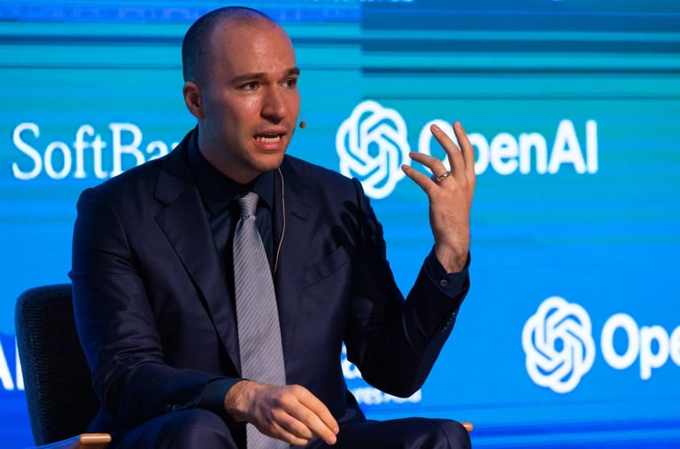 a man in a suit and tie is sitting in a chair