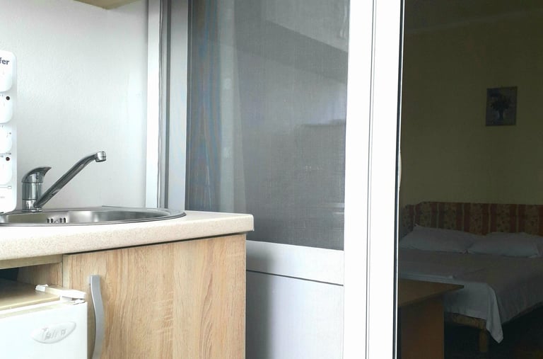 a kitchen with a refrigerator and a refrigerator freezer