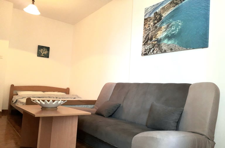 a couch with a bowl of fruit on it