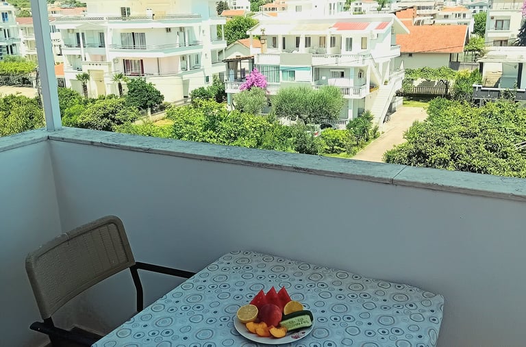 a plate of fruit on a table with a plate of fruit
