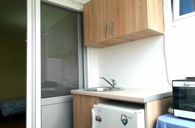 a kitchen with a refrigerator and a microwave