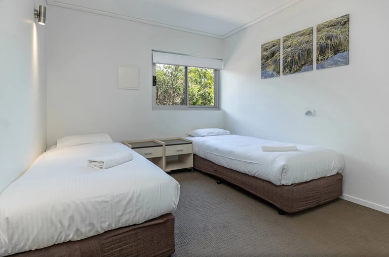 2 Long single beds to suit Adults or children. Can convert to Queen bed