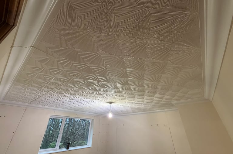 Our customer wanted a modern smooth surface to replace this outdated artexed ceiling.