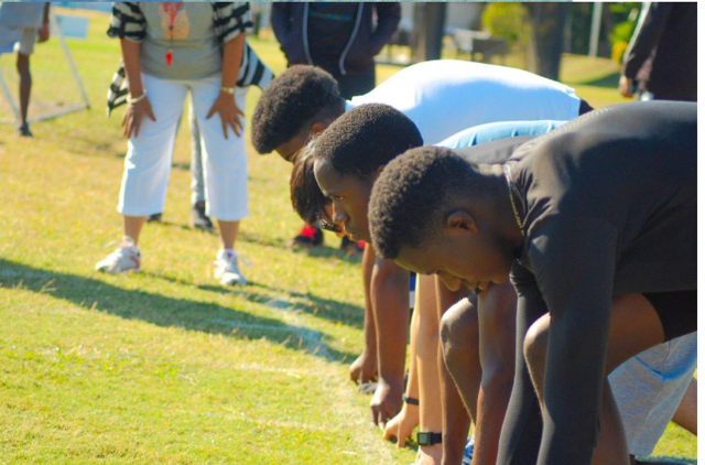 a group of young boys are lined up in a row