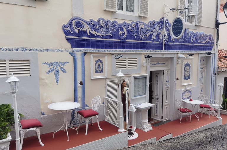 Traditional Portuguese restaurant front with blue azuelos in Madeira