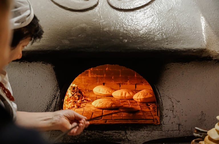 Traditional Sardinian bread baking in a wood-fired oven