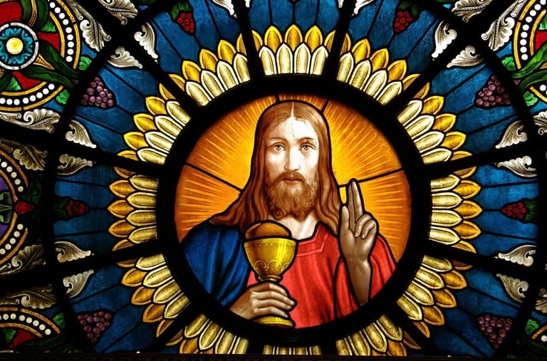 a stained glass window with a picture of jesus