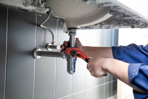 plumber fixing drain