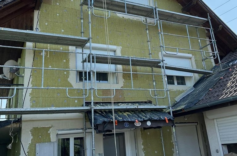 a house with a scafaffe on a scaffolded up to