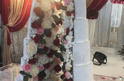 spilt wedding cake with roses in the middle 