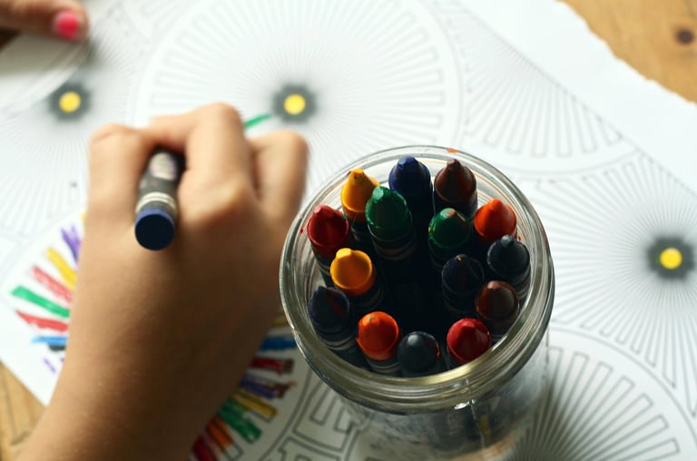 Child's hand with crayons