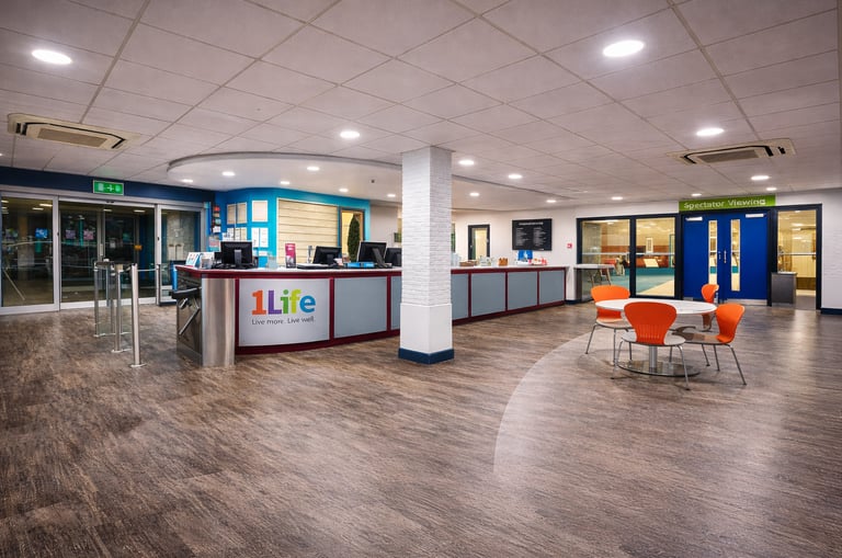 Reception and cafe seating area inside Lord Butler Leisure Centre in Saffron Walden