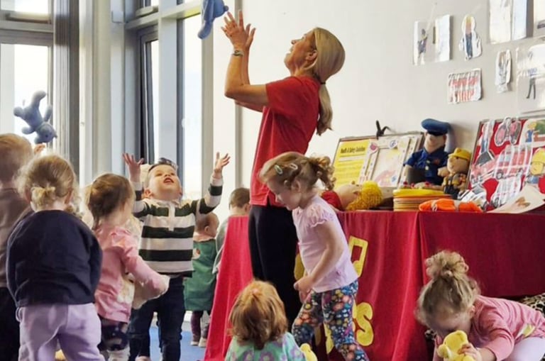 Children taking part in a Jo Jingles music and movement class at Sewards End Village Hall near Saffron Walden.