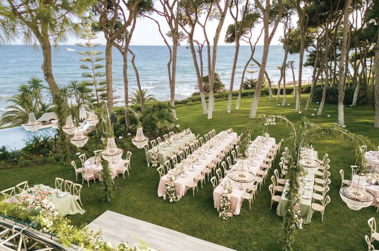 Aerial view of beachfront gala dinner setup in Marbella