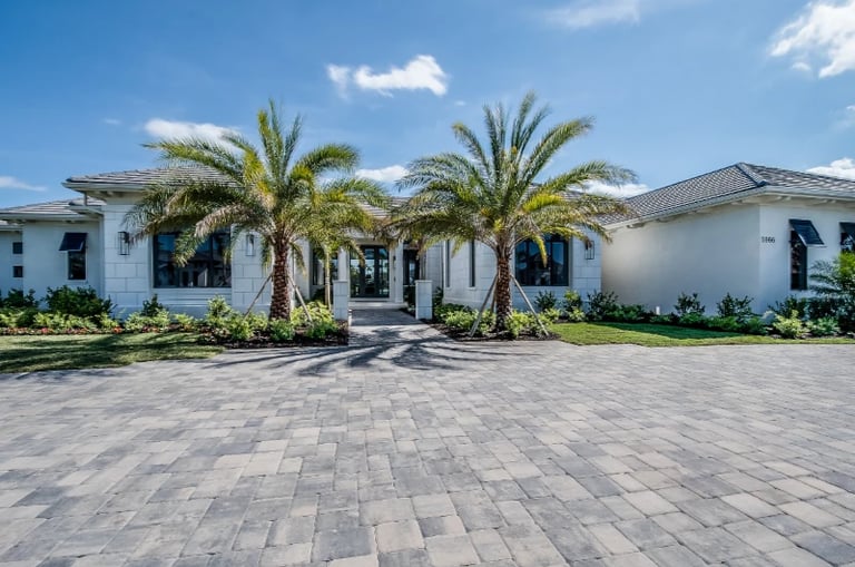Florida home with palm tress in front