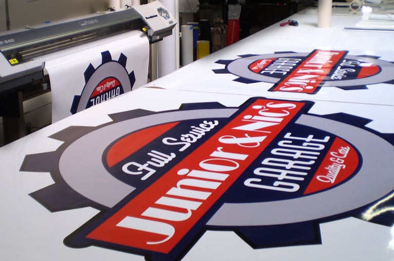 Printed signage and branded apparel by All Pro Signs