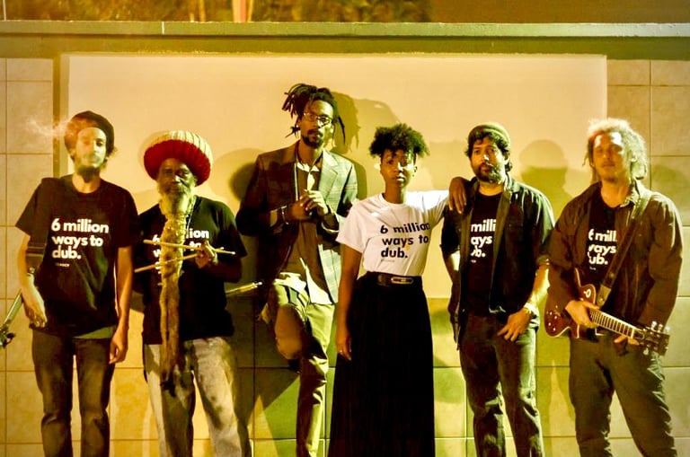 a group of people standing in front of a wall