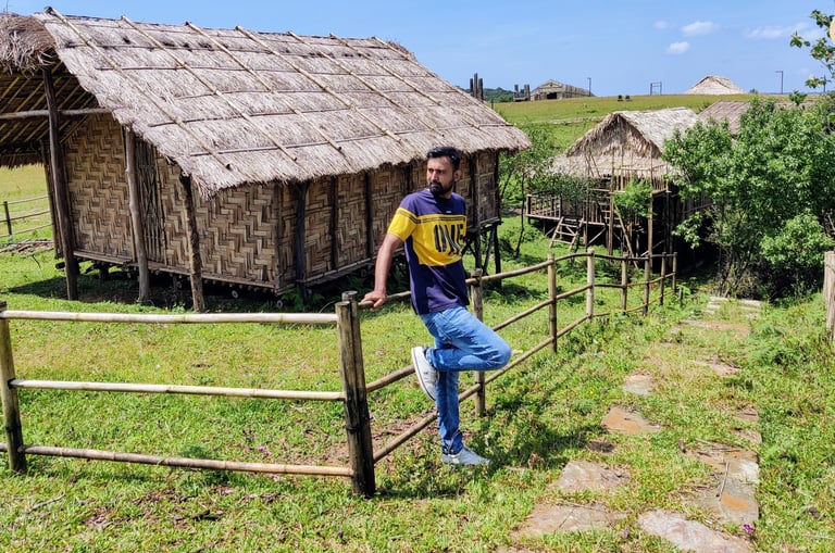 Khasi Heritage Village, Meghalaya - walking past traditional huts.