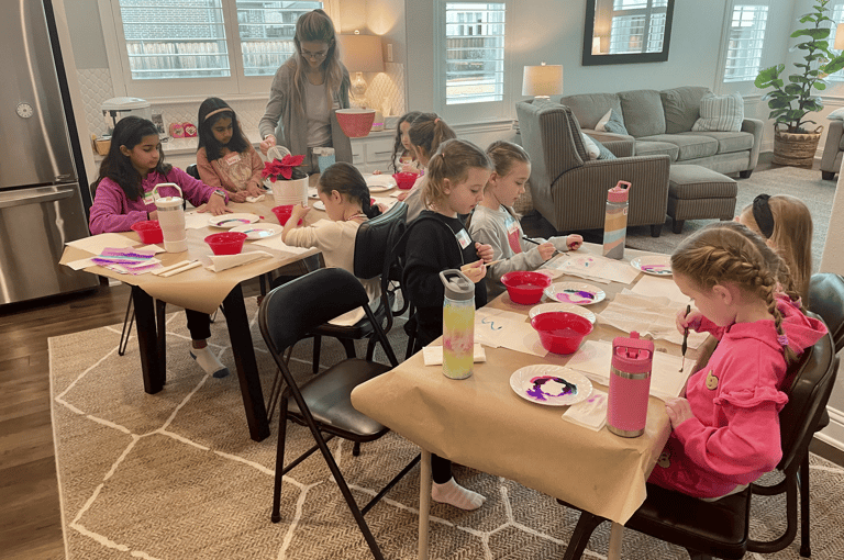 Kids enjoying watercolor painting lessons with instructor Kelley at Kelley’s Neighborhood Art.